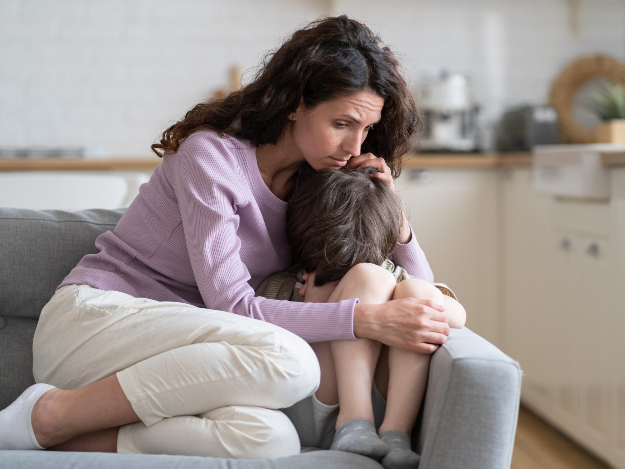 Photo for Tantrum vs Meltdown Blog 103026 Parent comforting an upset child with autism during a moment of emotional distress.